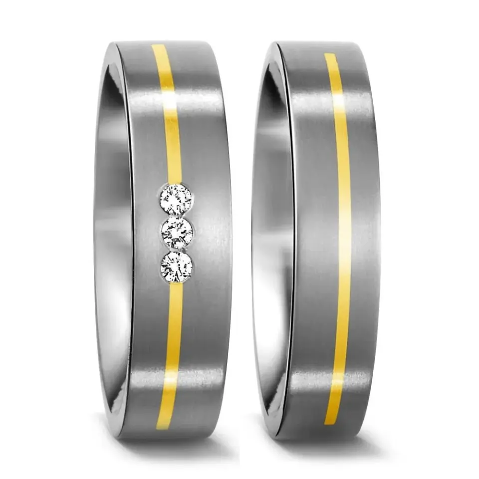 Alianzas de boda de titanio y oro amarillo con diamantes