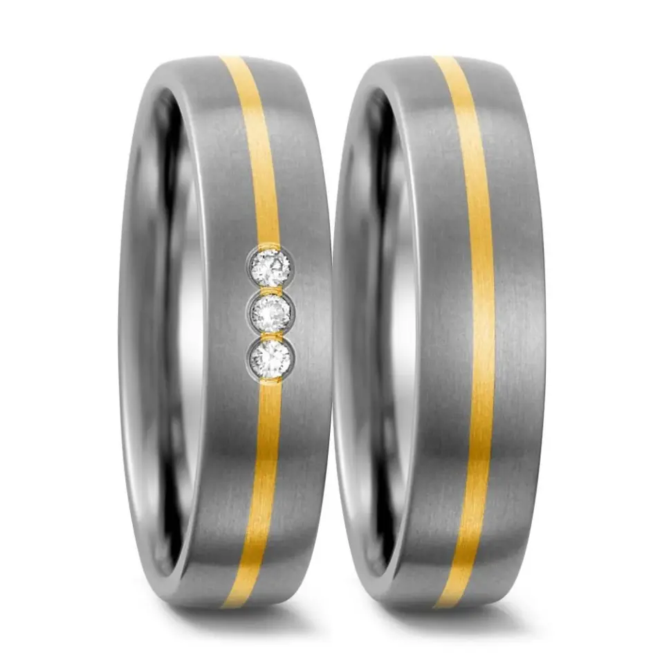 Alianzas de boda de titanio y oro amarillo con diamantes