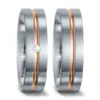 Alianzas de boda de acero y oro rosado con diamante