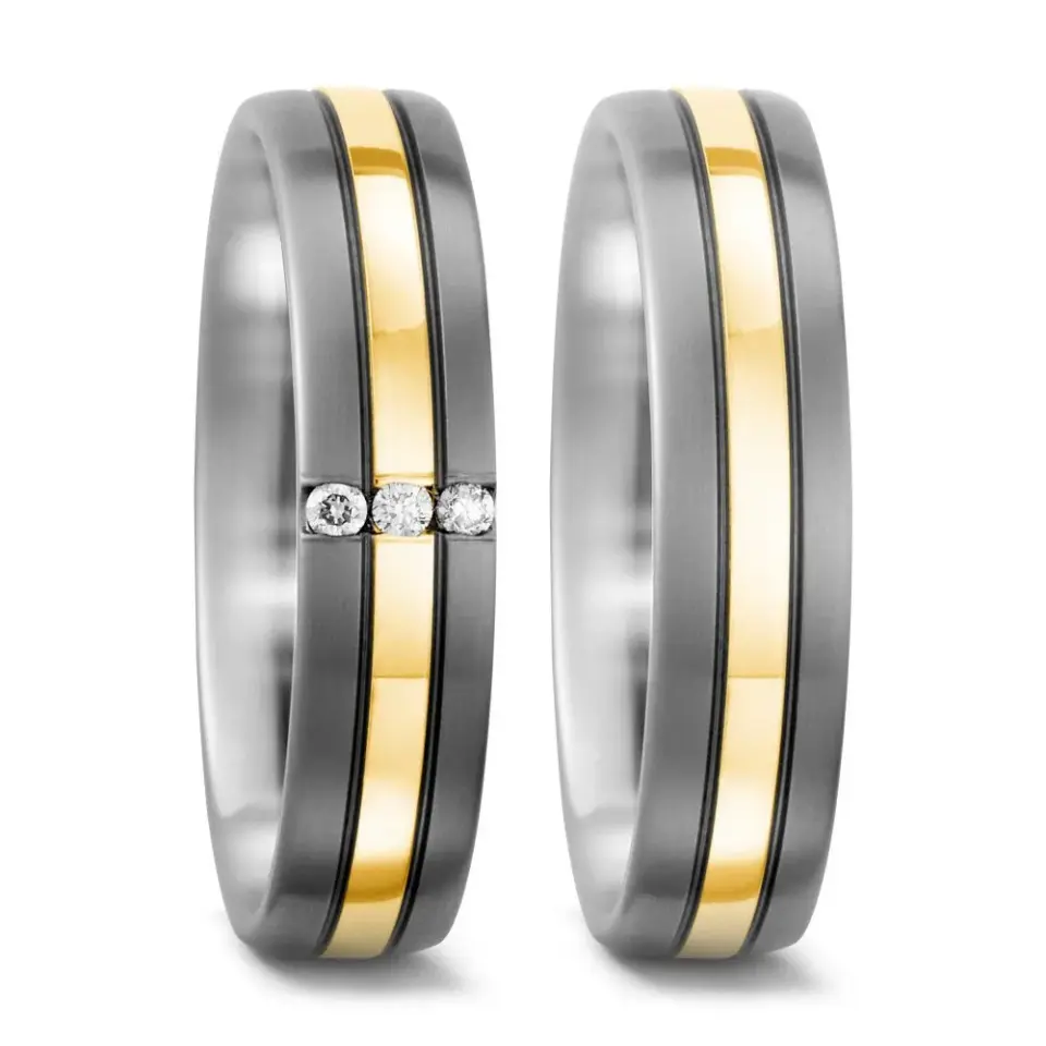 Alianzas de boda de titanio y oro amarillo con diamantes