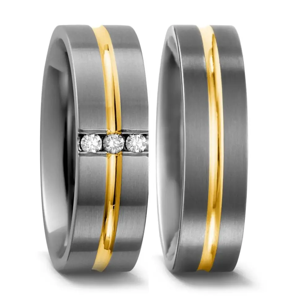 Alianzas de boda de titanio y oro amarillo con diamantes