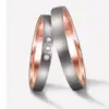 Alianzas de boda de titanio y oro rosado con diamantes