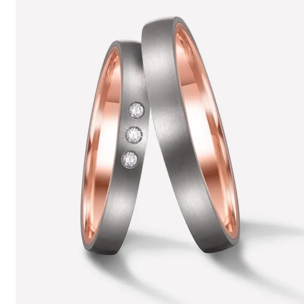 Alianzas de boda de titanio y oro rosado con diamantes