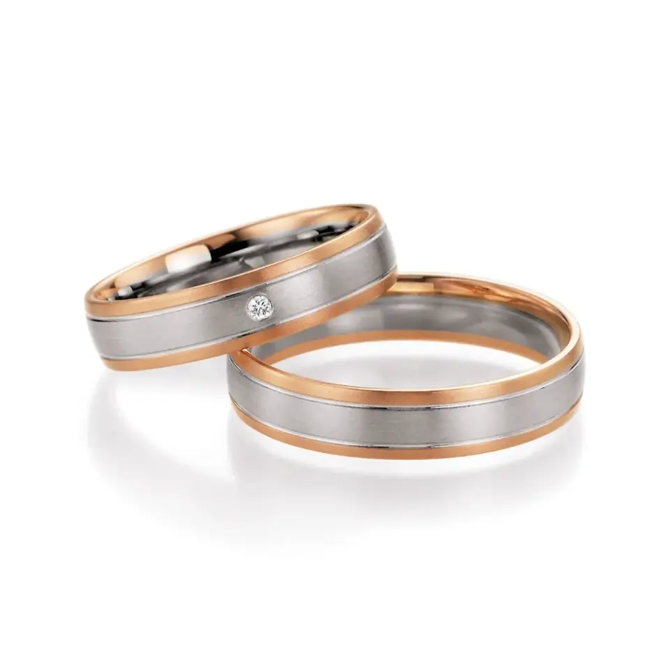 Alianzas de boda de oro rosado y platino con diamante