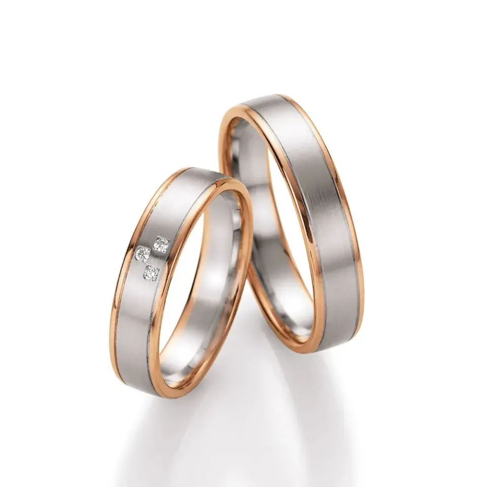 Alianzas de boda de oro rosado y platino con diamantes