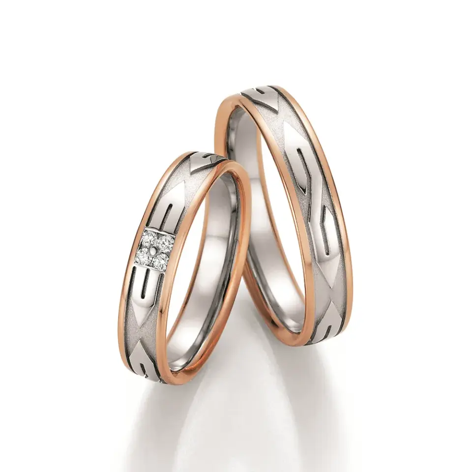 Alianzas de boda de oro rosado y platino con diamantes