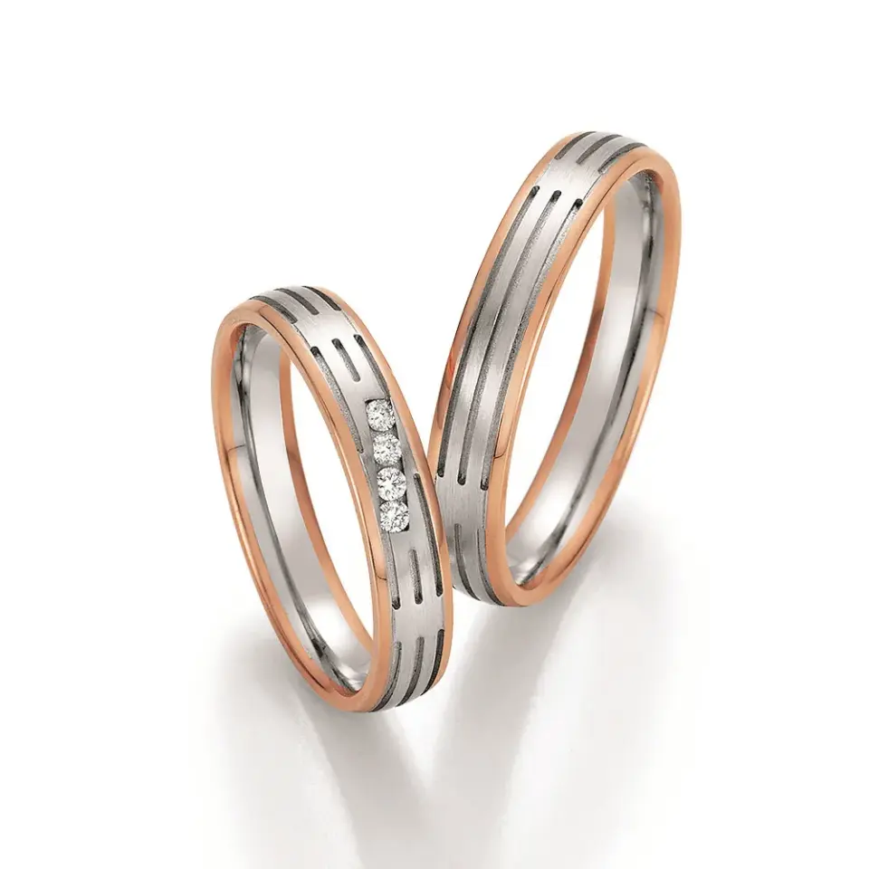 Alianzas de boda de oro rosado y paladio con diamantes
