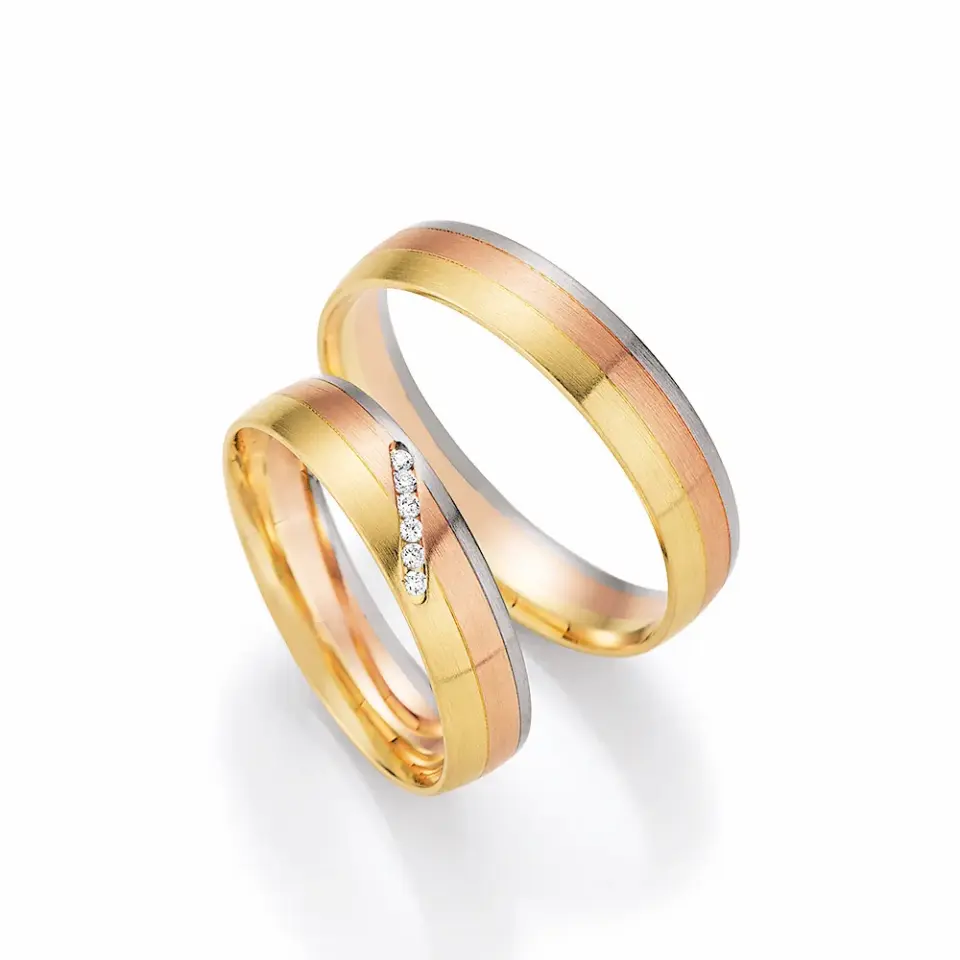 Alianzas de boda de oro amarillo, oro rosado y paladio con diamantes
