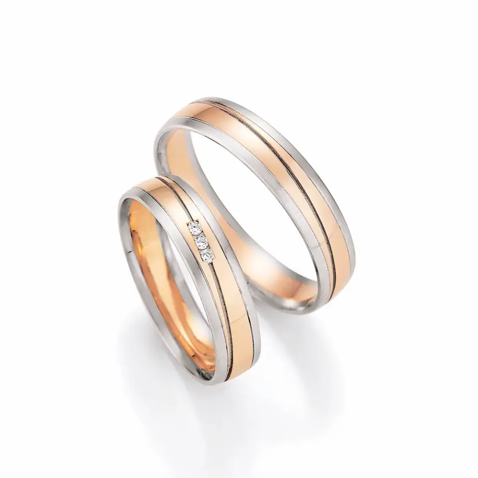 Alianzas de boda de platino y oro rosado con diamantes