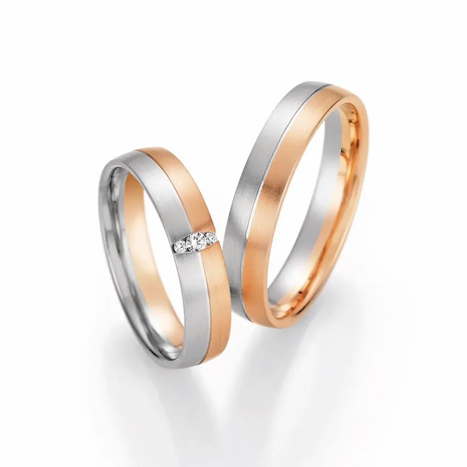 Alianzas de boda de platino y oro rosado con diamantes