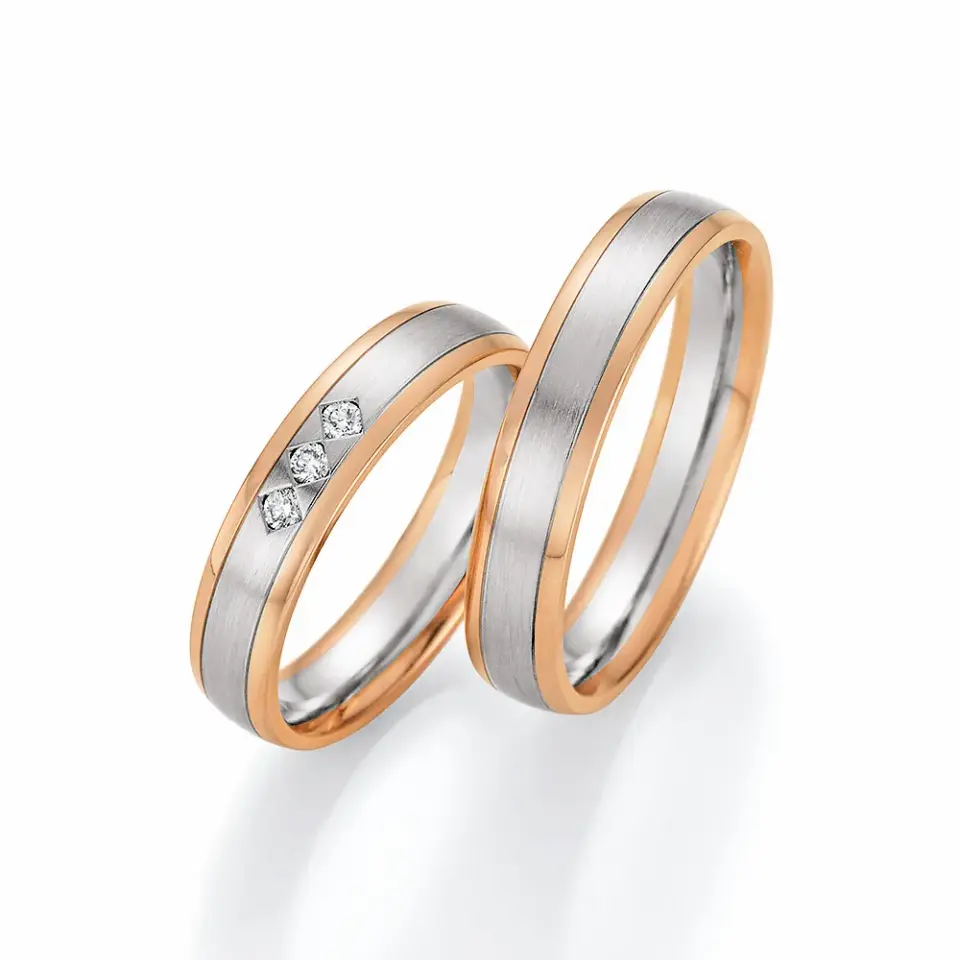 Alianzas de boda de oro rosado y paladio con diamantes