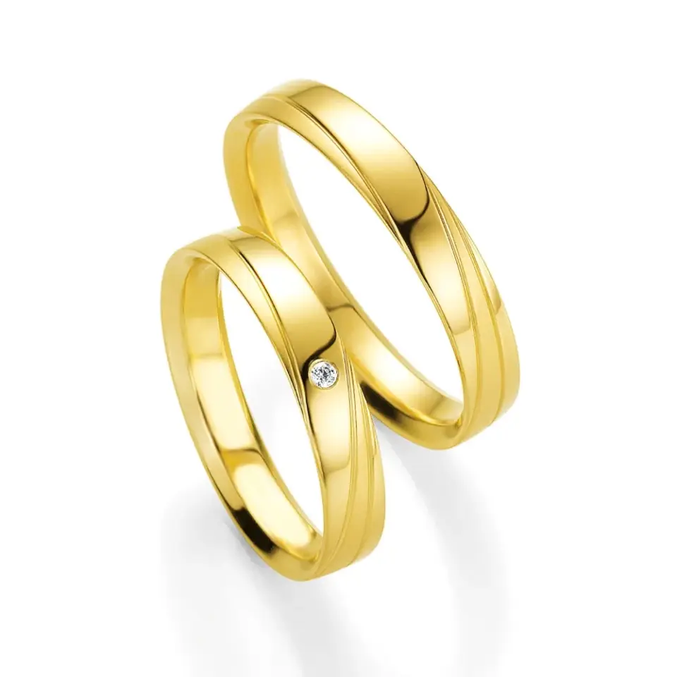 Alianzas de boda de oro amarillo con diamante