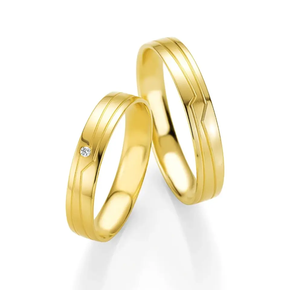 Alianzas de boda de oro amarillo con diamante