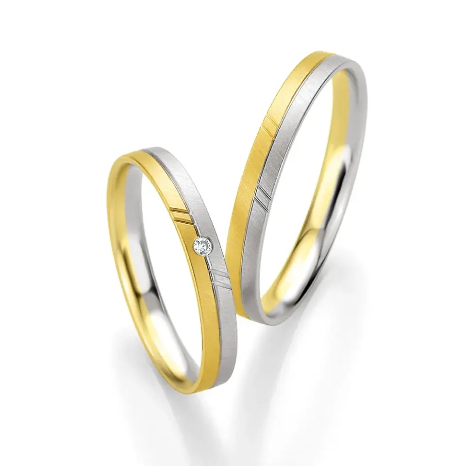 Alianzas de boda de oro amarillo y paladio con diamante