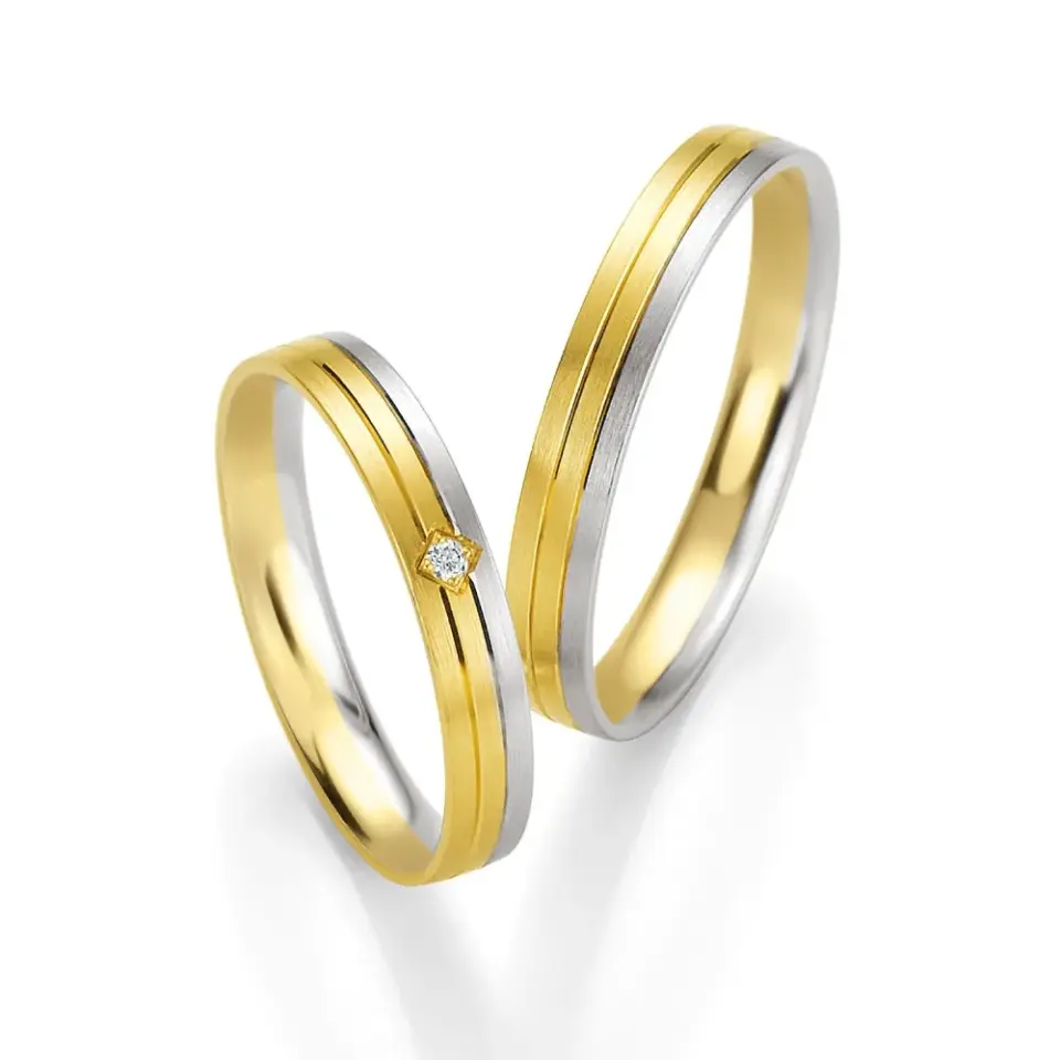 Alianzas de boda de oro amarillo y paladio con diamante