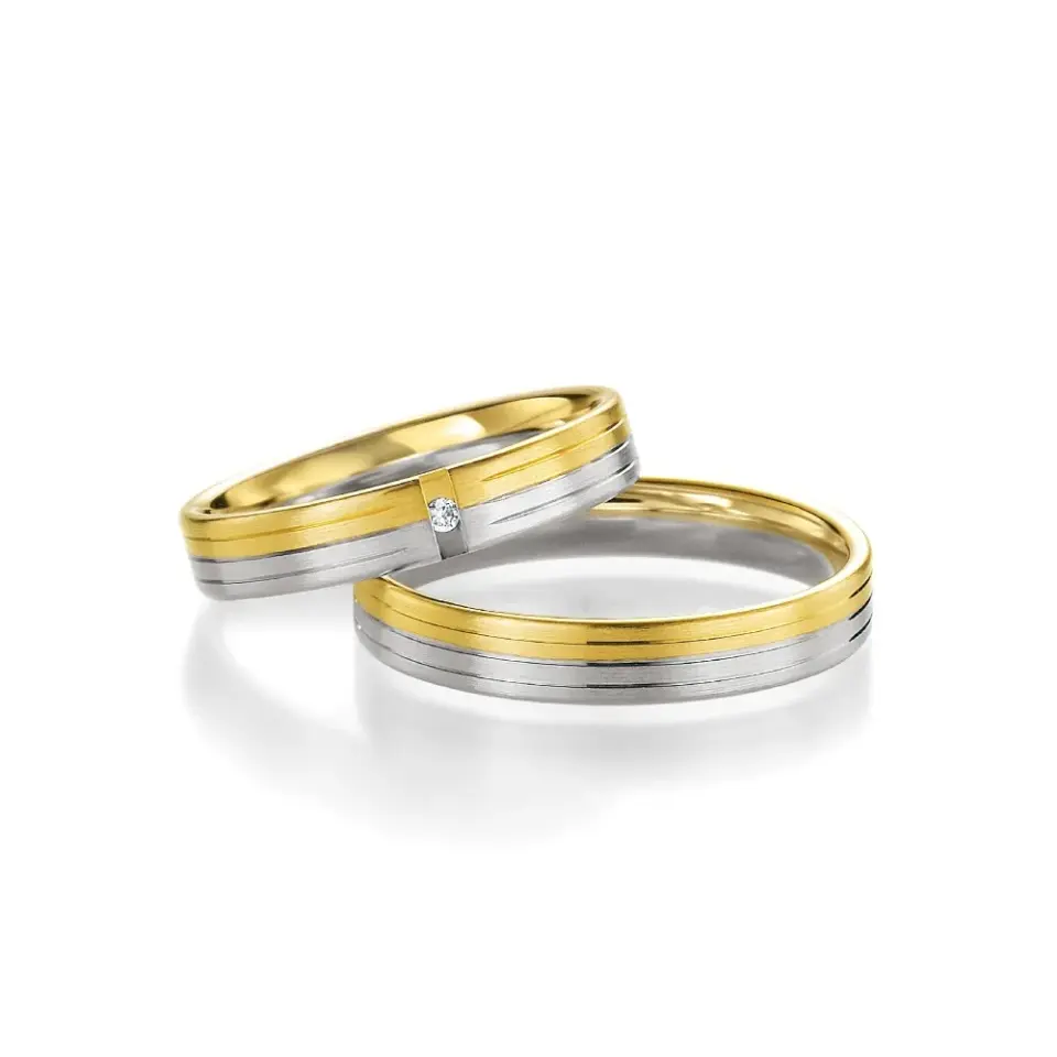 Alianzas de boda de oro amarillo y paladio con diamante