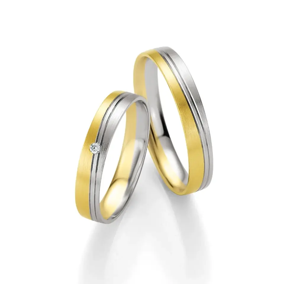 Alianzas de boda de oro amarillo y paladio con diamante