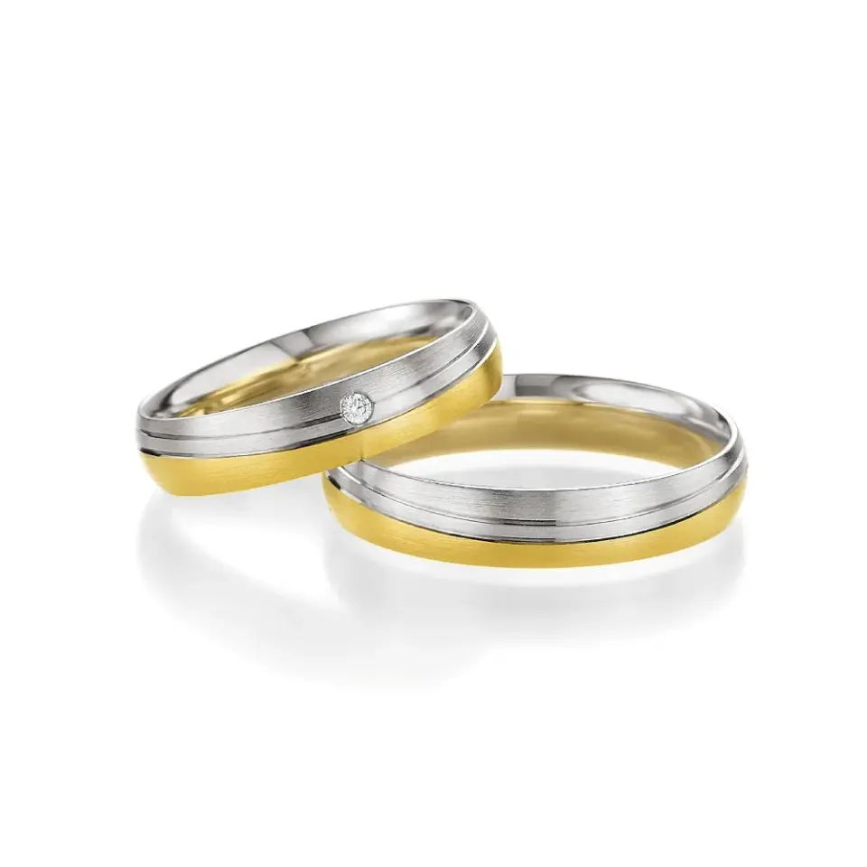 Alianzas de boda de oro amarillo y paladio con diamante