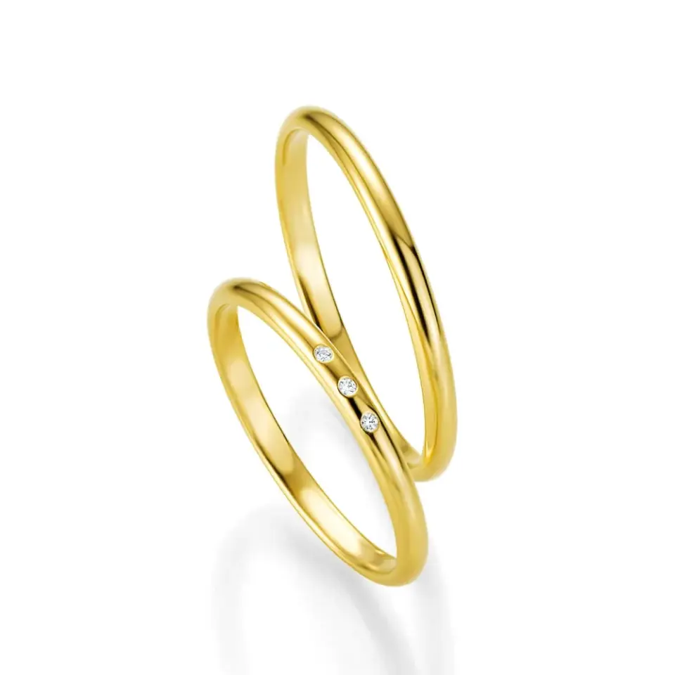 Alianzas de boda de oro amarillo con diamantes