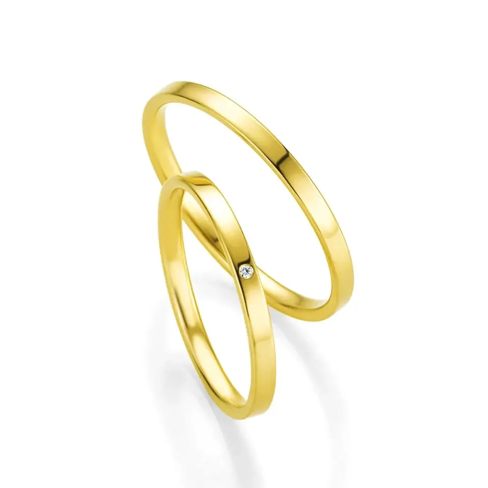 Alianzas de boda de oro amarillo con diamante