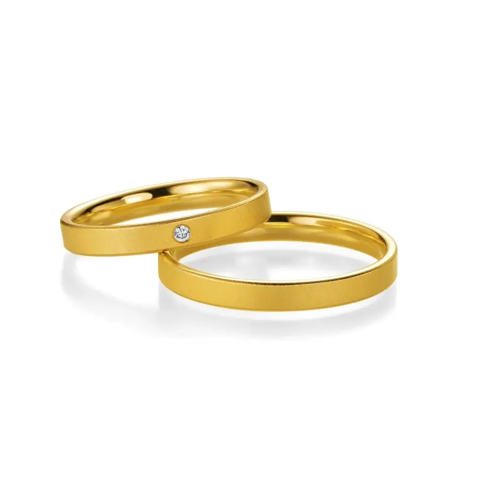 Alianzas de boda de oro amarillo con diamante