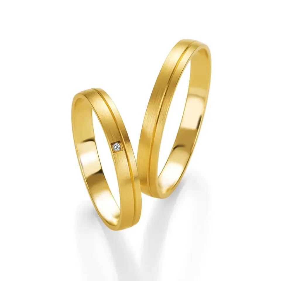 Alianzas de boda de oro amarillo con diamante