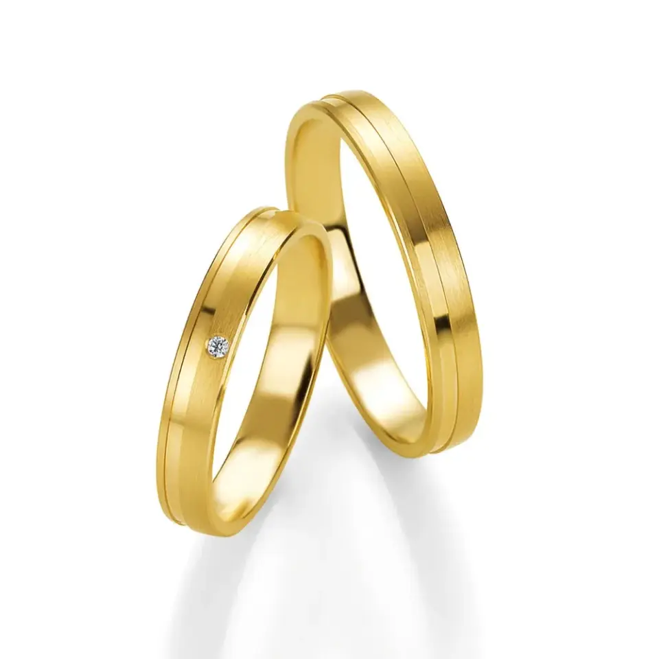Alianzas de boda de oro amarillo con diamante