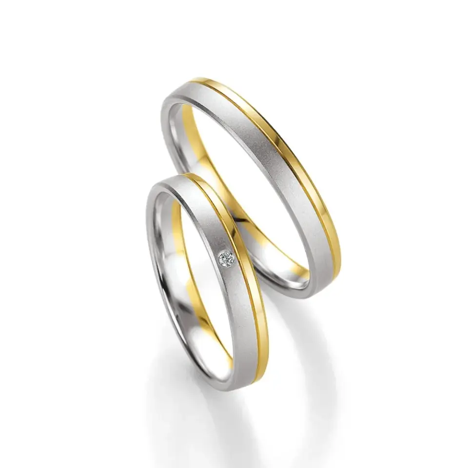 Alianzas de boda de oro amarillo y paladio con diamante