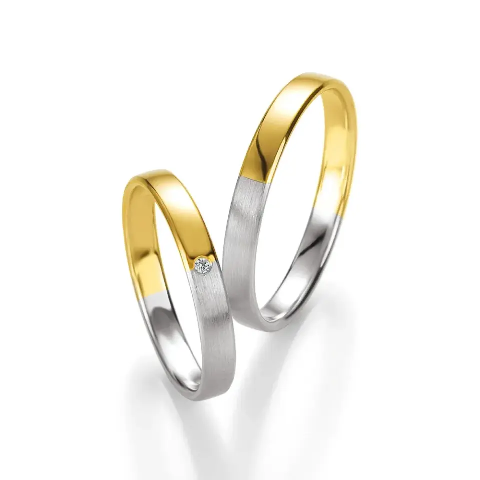 Alianzas de boda de oro amarillo y paladio con diamante