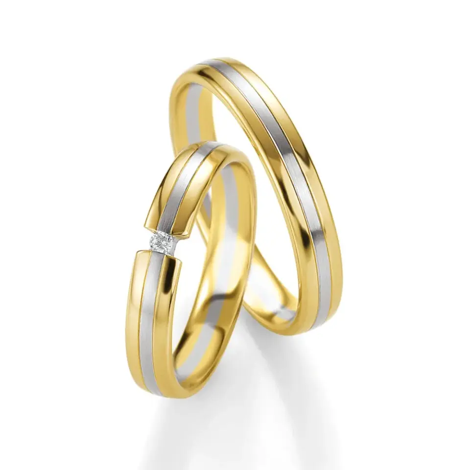 Alianzas de boda de oro amarillo y paladio con diamante