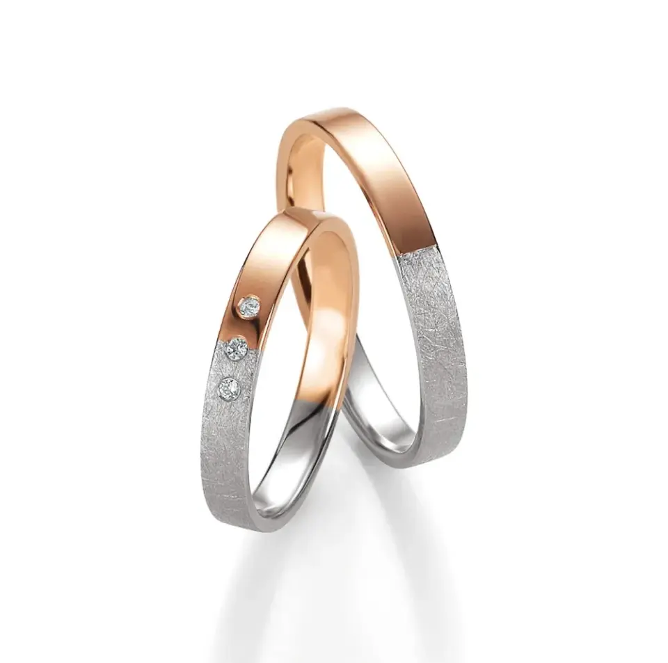 Alianzas de boda de oro rosado y paladio con diamantes