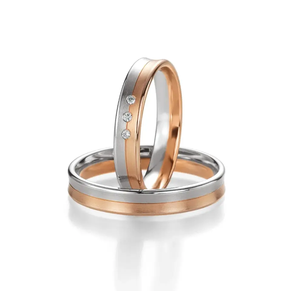 Alianzas de boda de oro rosado y paladio con diamantes