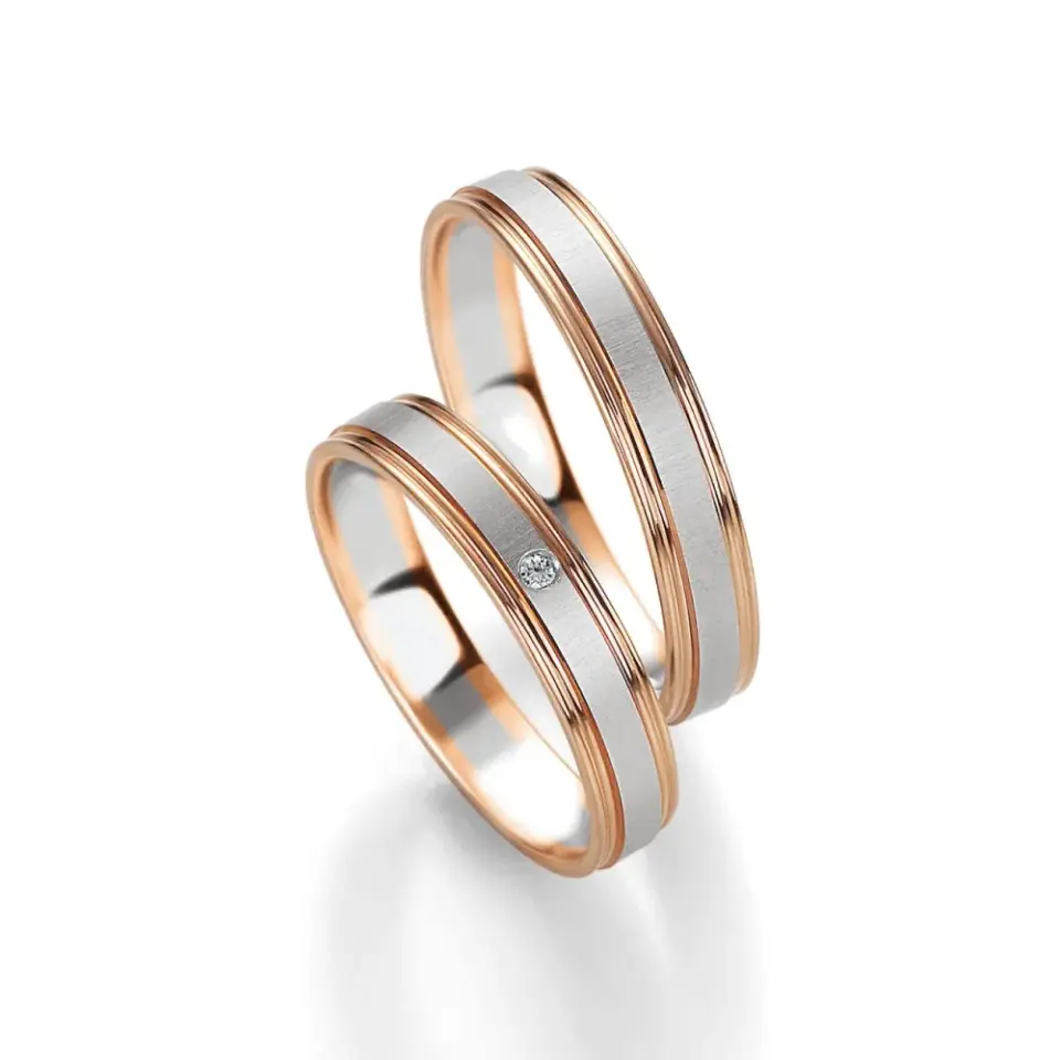 Alianzas de boda de oro rosado y paladio con diamante
