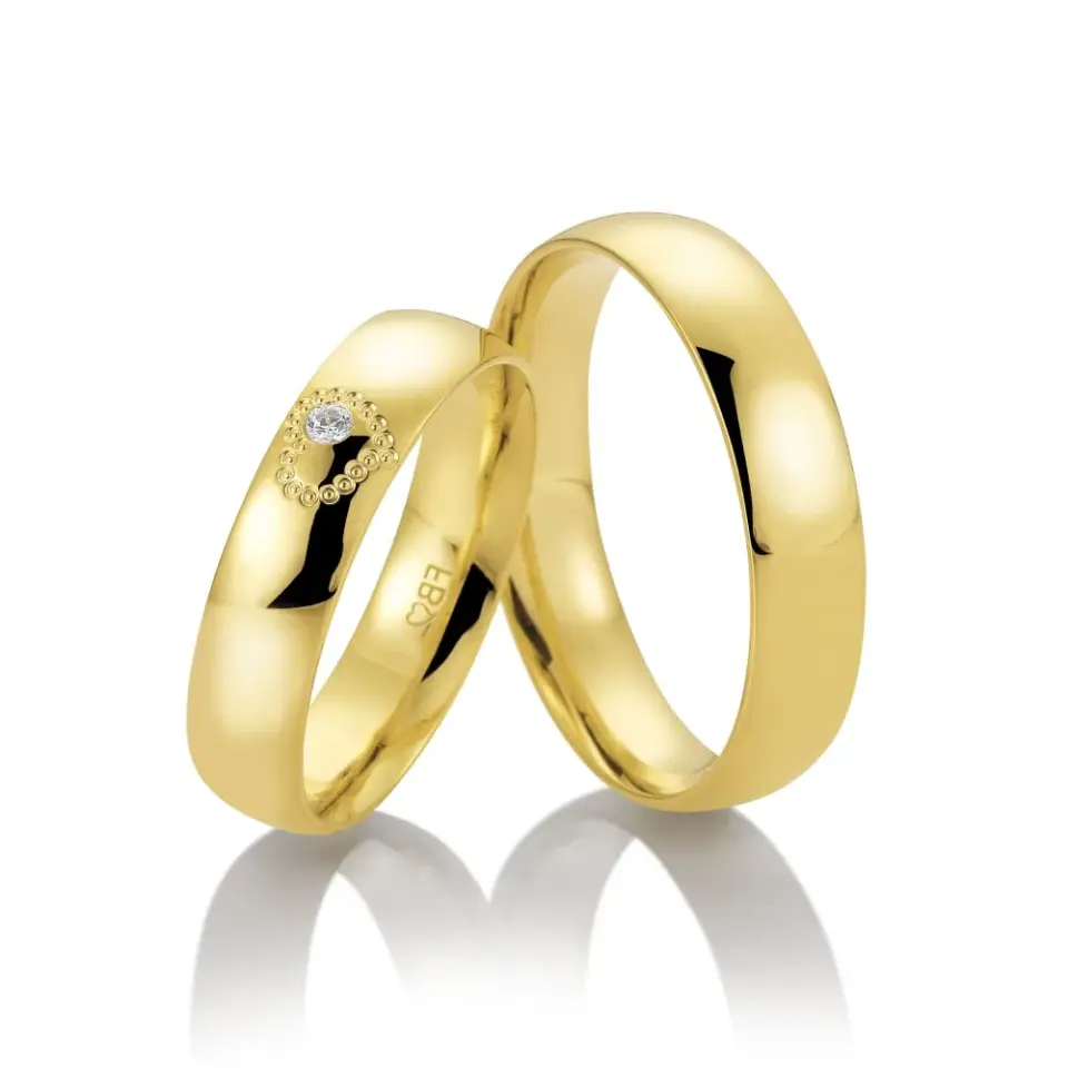 Alianzas de boda de oro amarillo con diamante