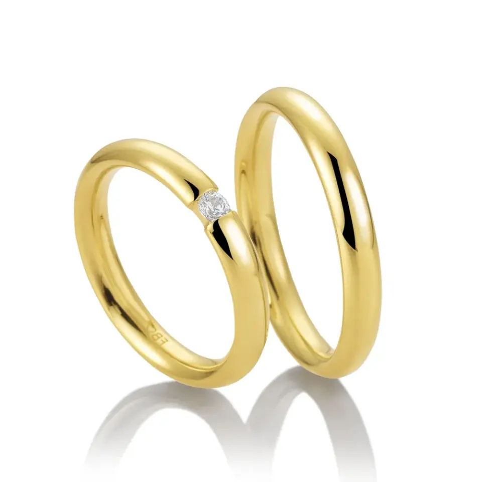 Alianzas de boda de oro amarillo con diamante