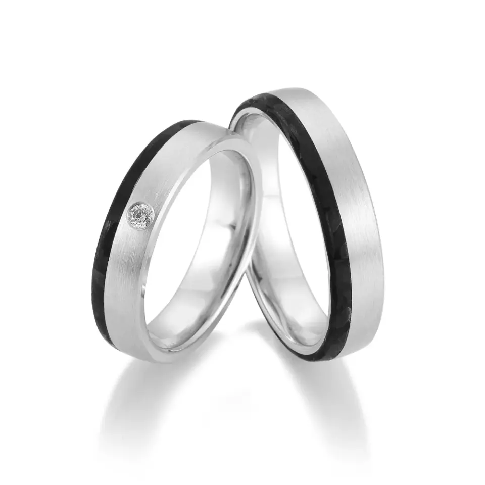 Alianzas de boda de paladio y carbono con diamante