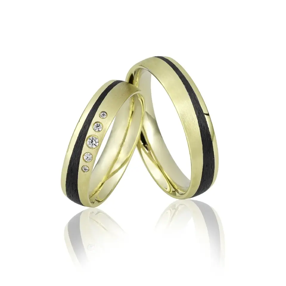 Alianzas de boda de oro amarillo y carbono con diamantes