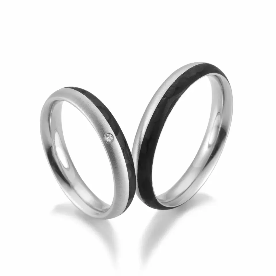 Alianzas de boda de paladio y carbono con diamante