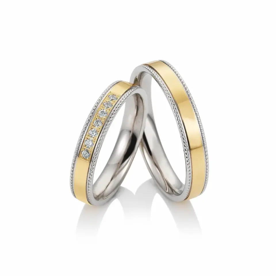 Alianzas de boda de oro amarillo y paladio con diamantes