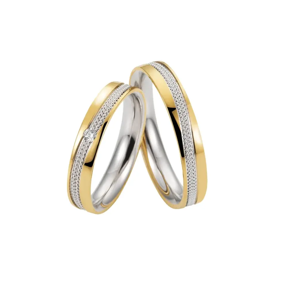 Alianzas de boda de oro amarillo y paladio con diamante