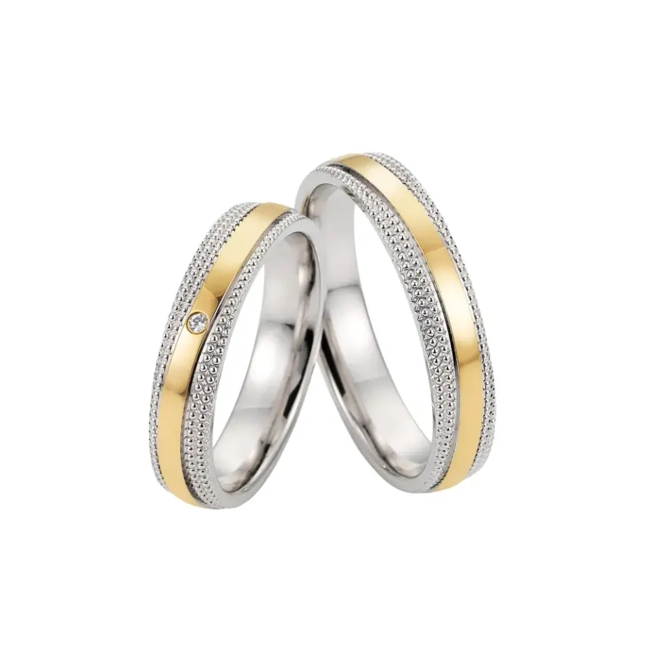 Alianzas de boda de oro amarillo y paladio con diamante