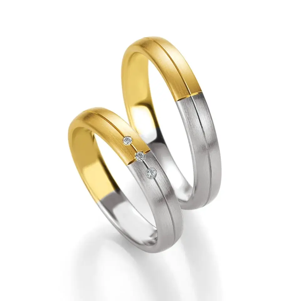 Alianzas de boda de oro amarillo y oro blanco con diamantes