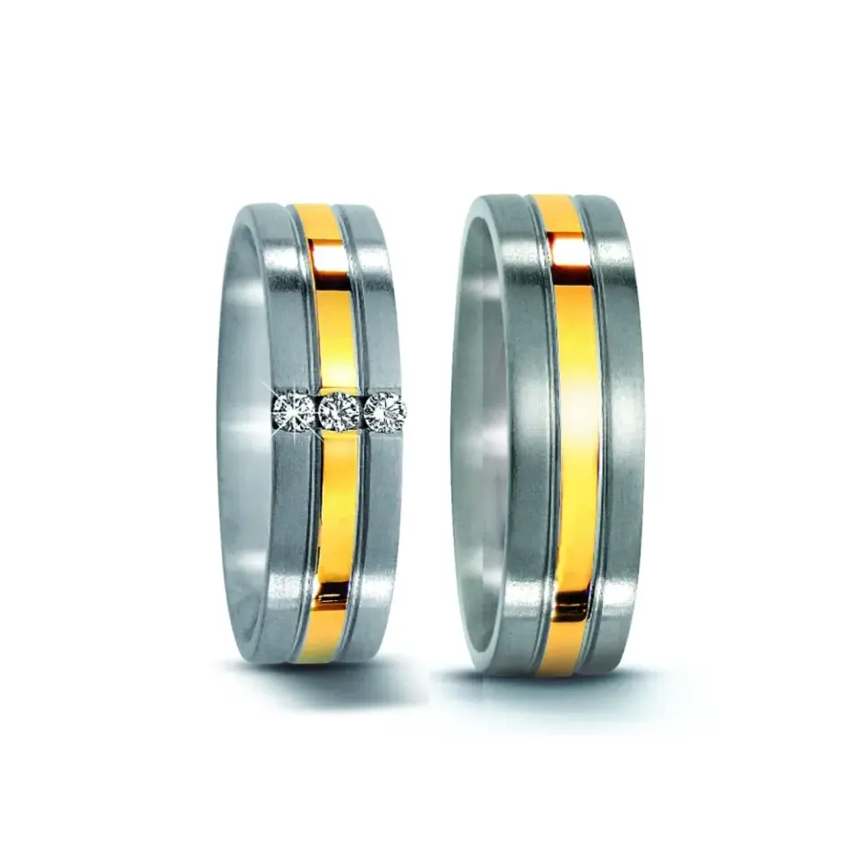 Alianzas de boda de acero y oro amarillo con diamantes