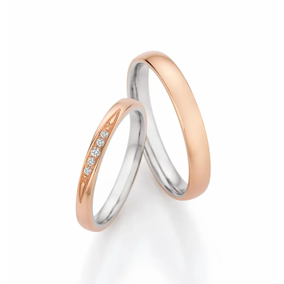 Alianzas de boda de oro rosado y oro blanco con diamantes