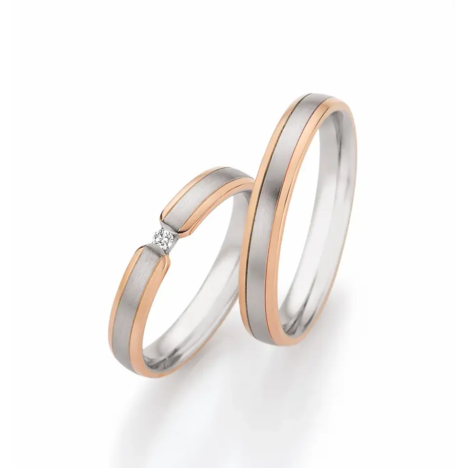 Alianzas de boda de oro rosado y paladio con diamante