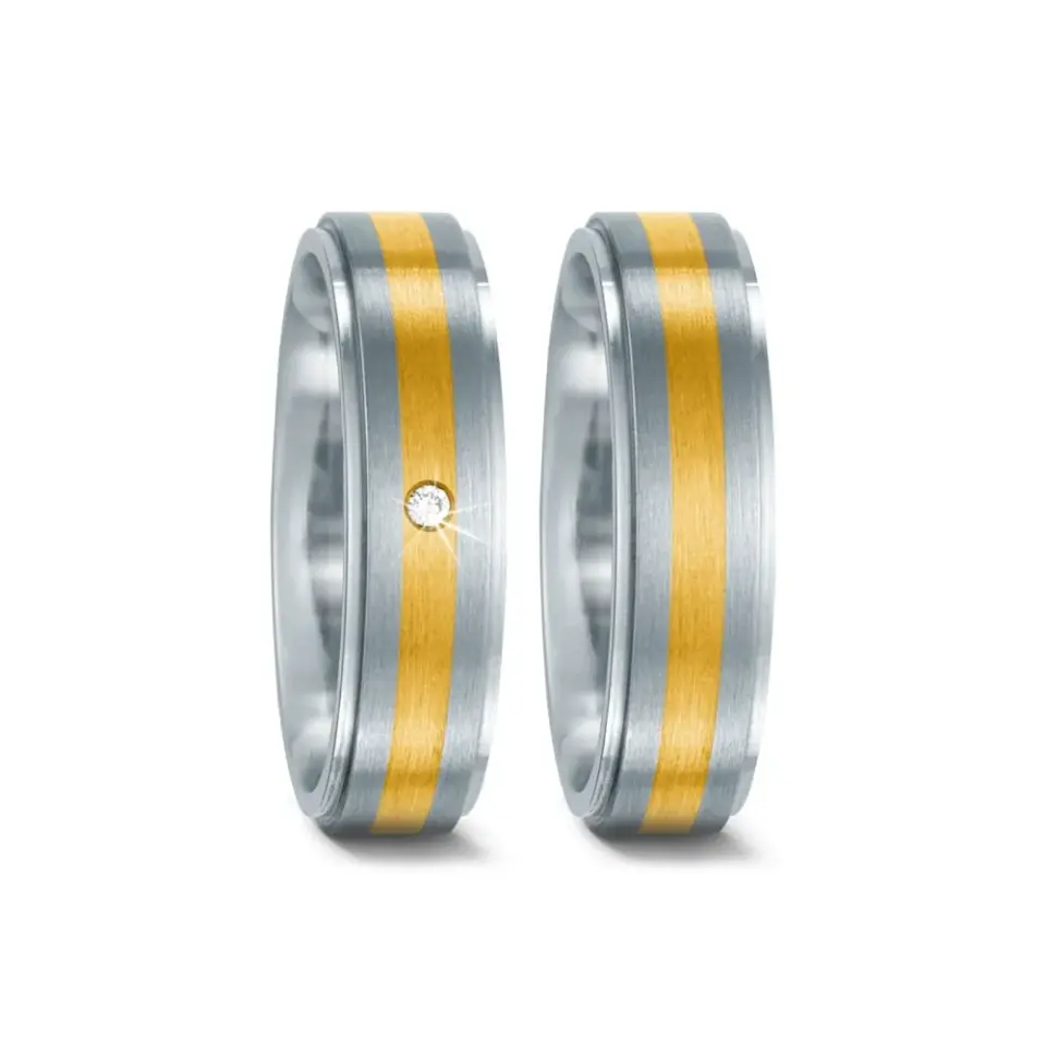 Alianzas de boda de acero y oro amarillo con diamante