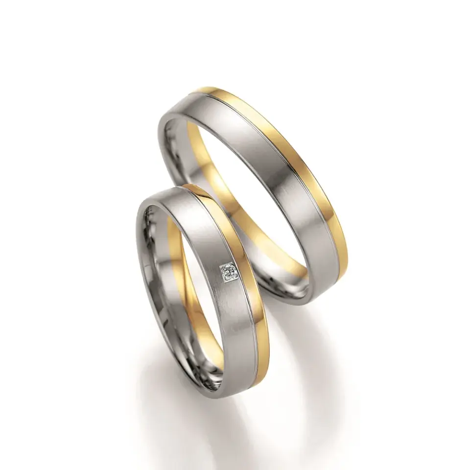 Alianzas de boda de paladio y oro amarillo con diamante