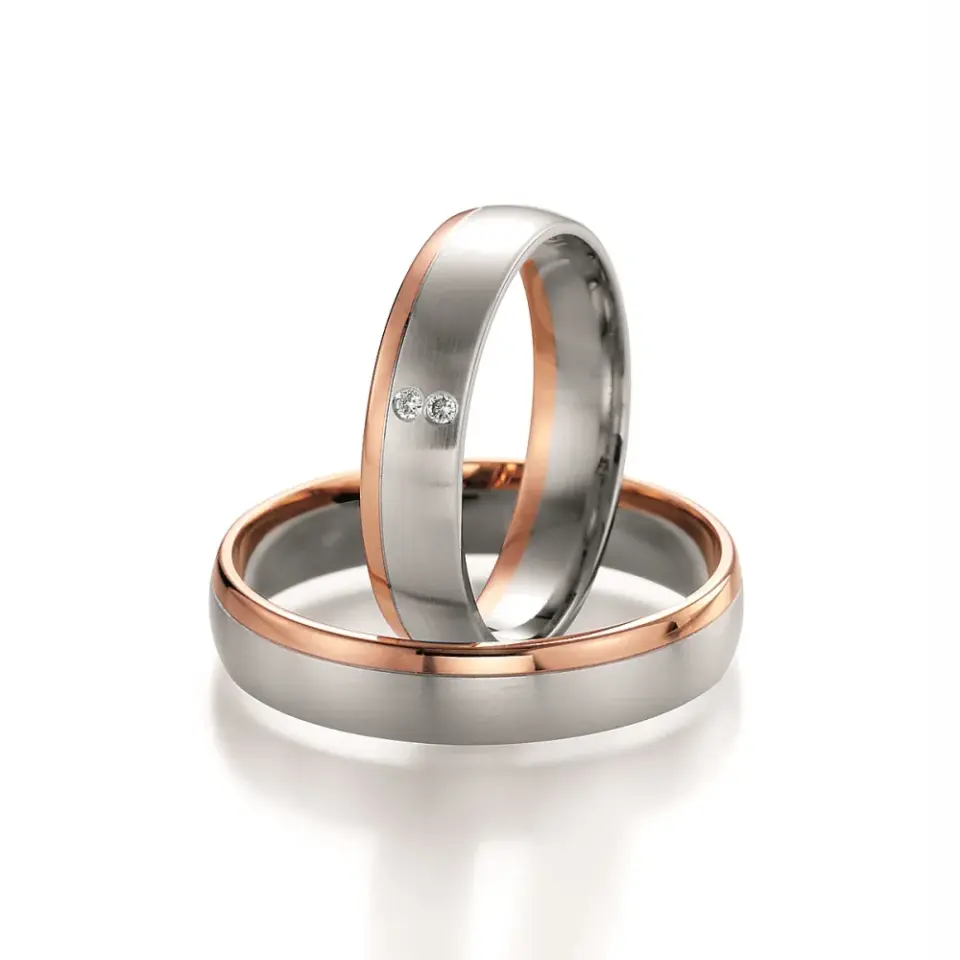 Alianzas de boda de platino y oro rosado con diamantes