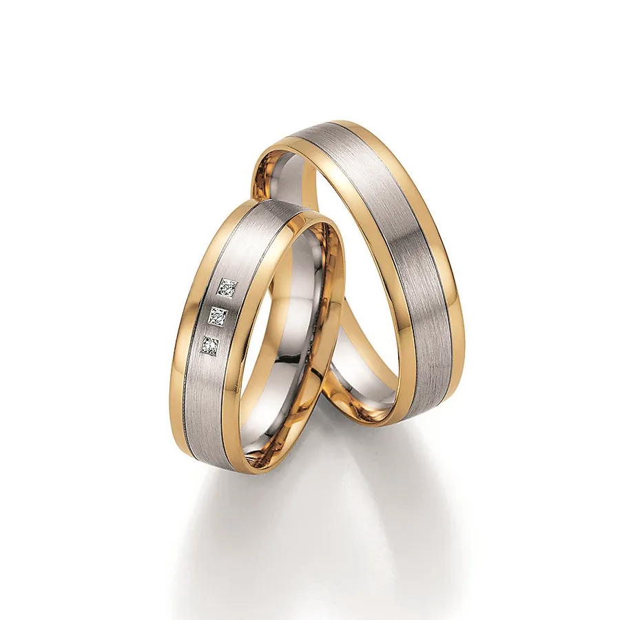 Alianzas de boda de oro amarillo y oro blanco con diamantes