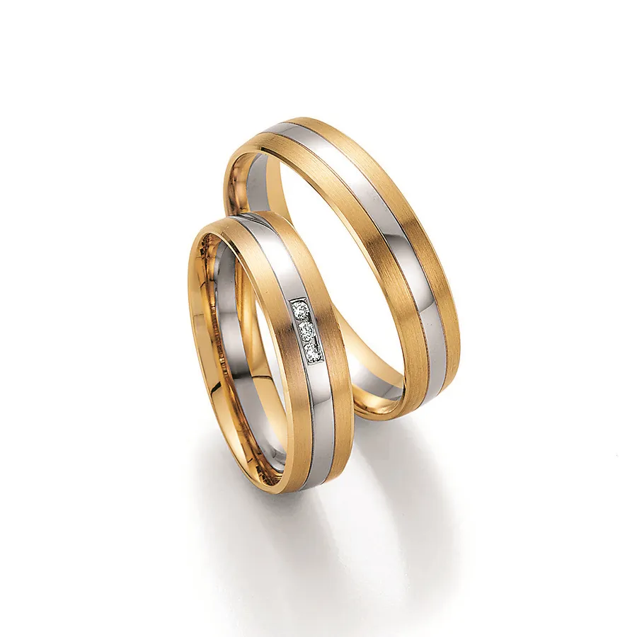 Alianzas de boda de oro amarillo y oro blanco con diamantes